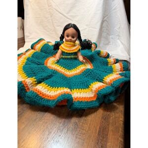 Vintage handmade Native American bed doll with vibrant crochet dress. Decorative